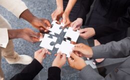Workers put puzzle pieces together