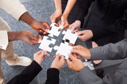 Workers put puzzle pieces together